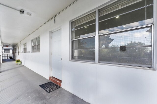 corridor with elevator and concrete floors