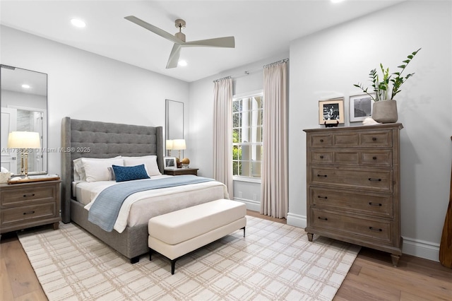 bedroom featuring ceiling fan and light hardwood / wood-style floors