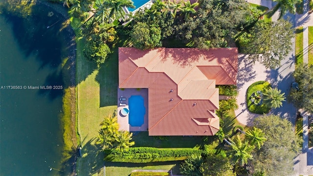 birds eye view of property with a water view