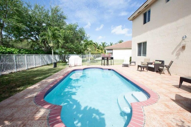 view of pool with a patio area