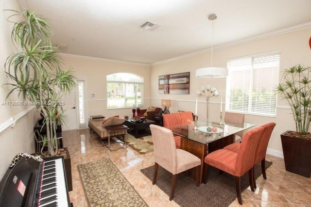 dining area with ornamental molding