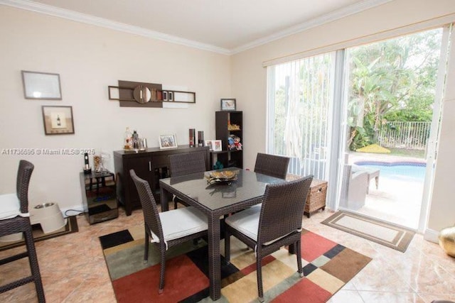 dining area featuring crown molding