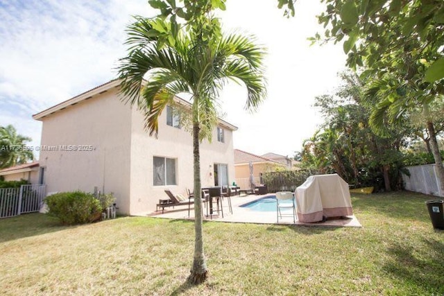 exterior space featuring a fenced in pool and a patio