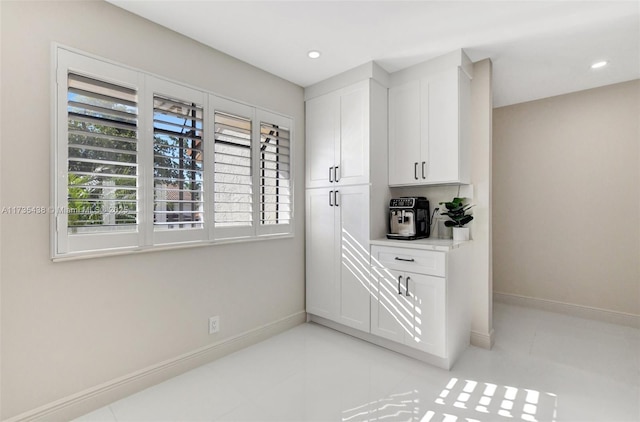 interior space featuring white cabinets