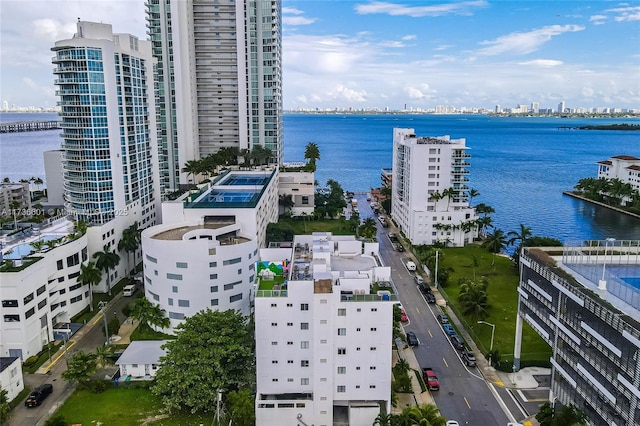 birds eye view of property with a water view