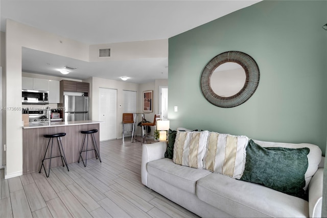 living room featuring light wood-type flooring