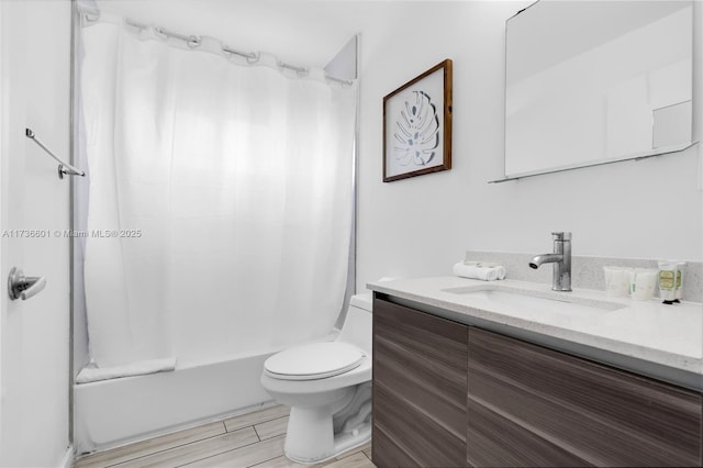 full bathroom with shower / bathtub combination with curtain, vanity, and toilet