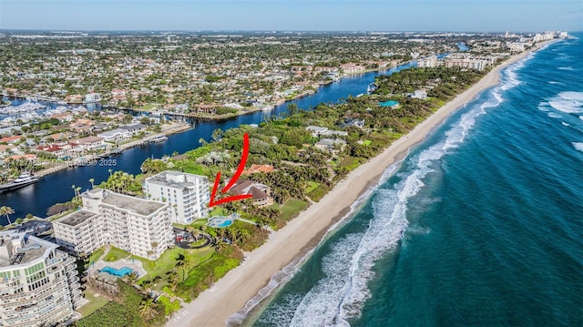 bird's eye view with a view of the beach and a water view