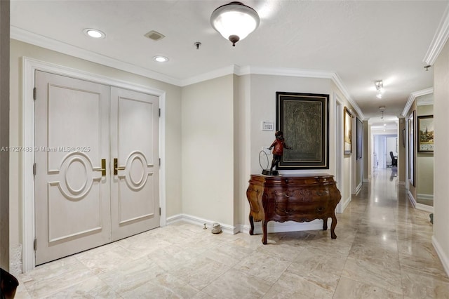 foyer featuring ornamental molding, recessed lighting, visible vents, and baseboards