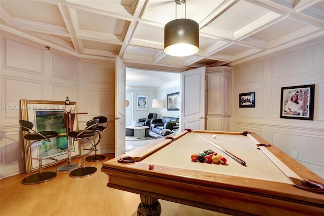 rec room featuring crown molding, coffered ceiling, pool table, beamed ceiling, and light wood-type flooring