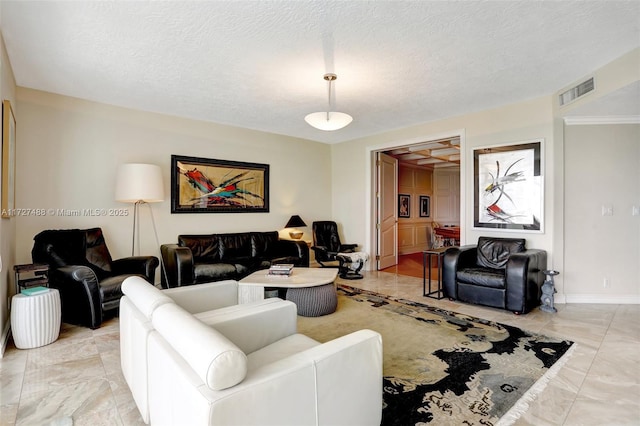 living room with a textured ceiling, visible vents, and baseboards