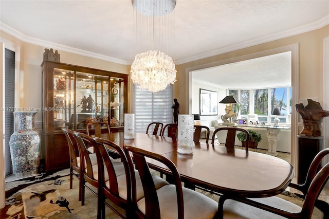 dining area featuring an inviting chandelier and ornamental molding