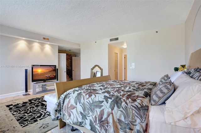 bedroom featuring a textured ceiling