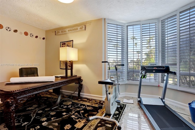 home office featuring a textured ceiling