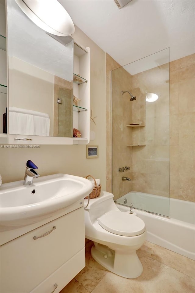 full bathroom featuring vanity, tile patterned flooring, bath / shower combo with glass door, and toilet