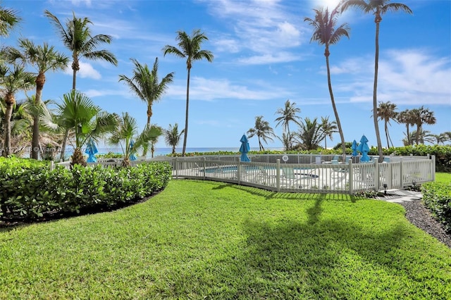 view of yard featuring a community pool