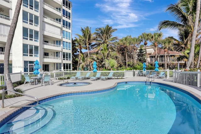 view of pool featuring a community hot tub