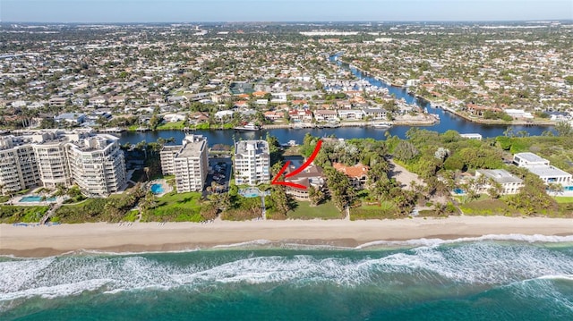 bird's eye view featuring a water view and a view of the beach