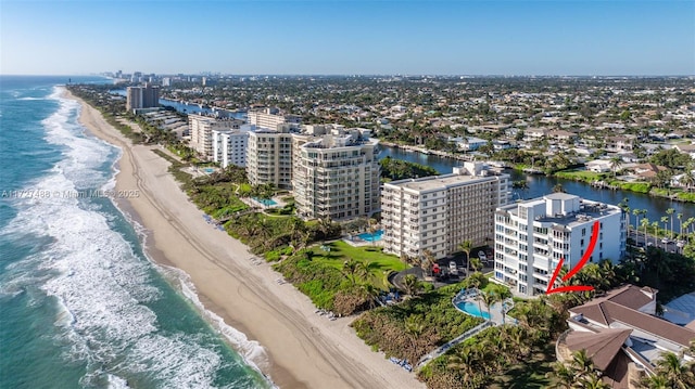 drone / aerial view with a view of the beach and a water view