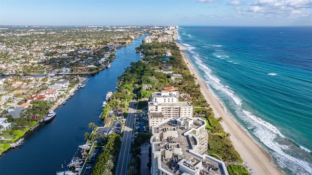 aerial view with a water view and a view of the beach