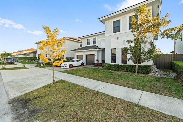 view of front of home featuring a garage and a front yard