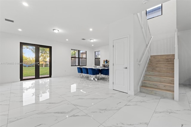 staircase with french doors