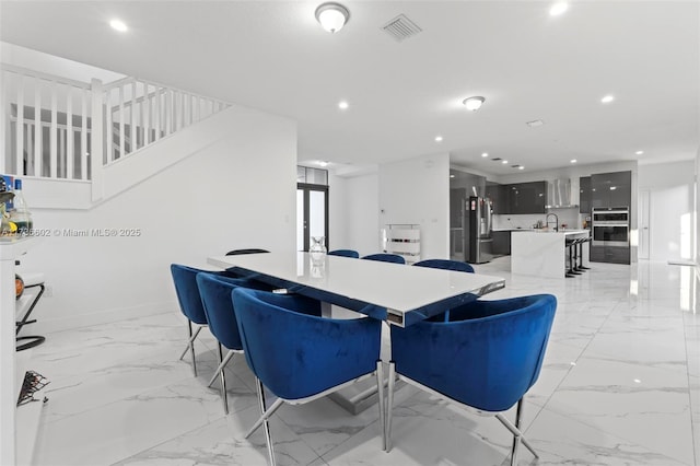 dining room featuring sink