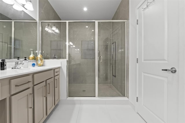 bathroom featuring walk in shower, tile patterned floors, and vanity