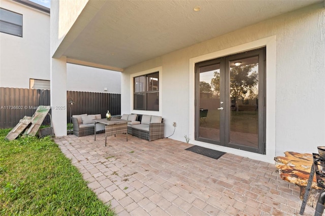 view of patio / terrace featuring an outdoor living space and french doors