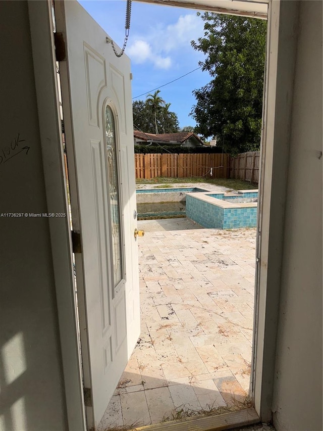 view of pool featuring an in ground hot tub and a patio area