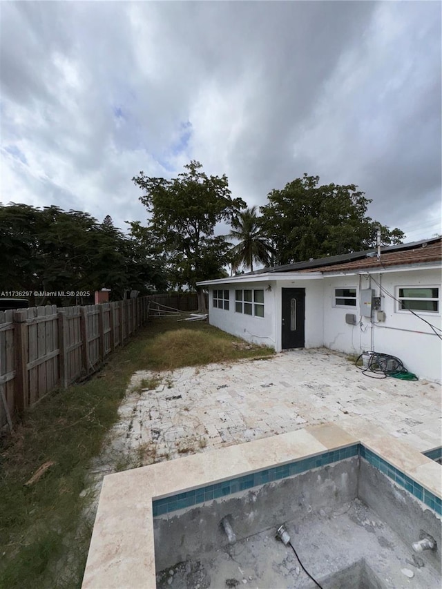 back of house with a patio area