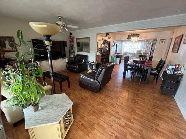 dining space featuring hardwood / wood-style flooring and an inviting chandelier