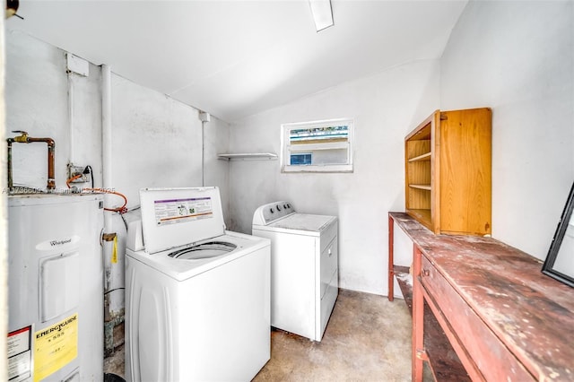 washroom with water heater and washing machine and dryer