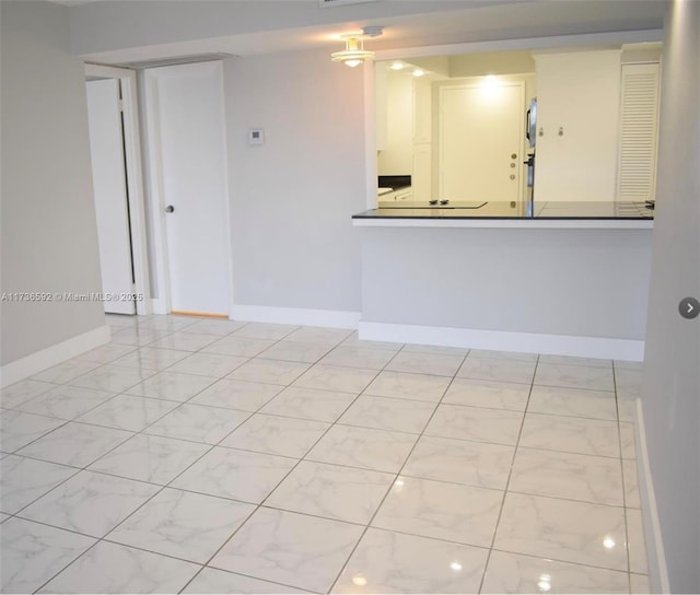 empty room featuring baseboards