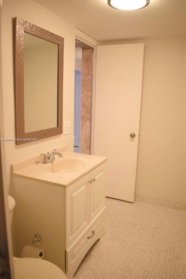 bathroom with vanity and toilet