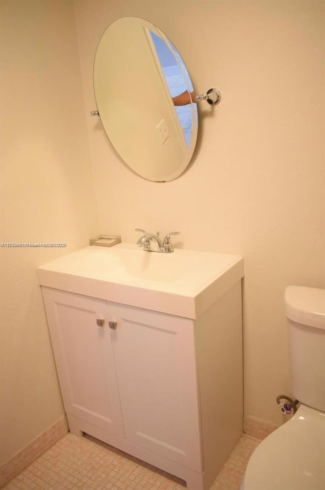 bathroom with vanity and toilet