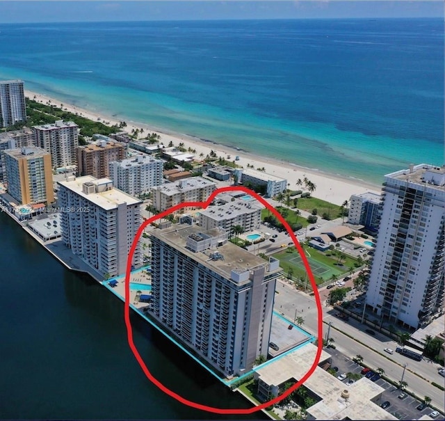 bird's eye view with a beach view, a view of city, and a water view