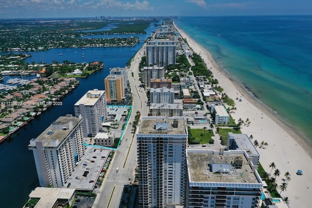 bird's eye view with a view of the beach, a water view, and a city view