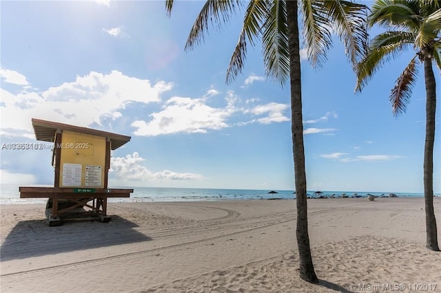 property view of water featuring a beach view