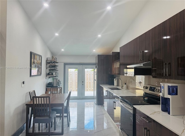 kitchen with sink, high vaulted ceiling, light stone counters, stainless steel electric stove, and french doors