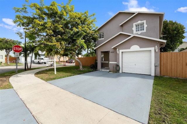 view of front property with a garage and a front yard