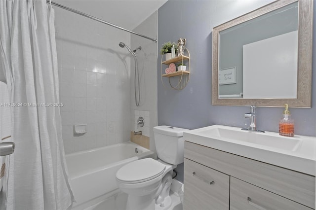 full bathroom with vanity, shower / tub combo, and toilet