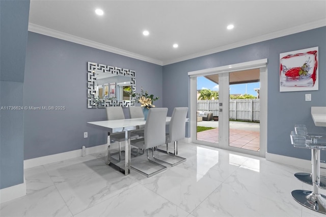 dining room featuring crown molding