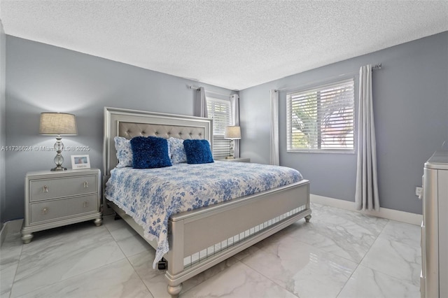 bedroom featuring a textured ceiling