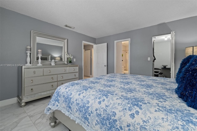 bedroom featuring a textured ceiling