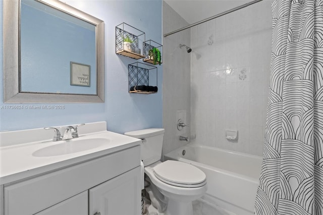 full bathroom featuring vanity, tiled shower / bath combo, and toilet