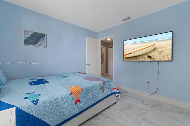 bedroom featuring a textured ceiling