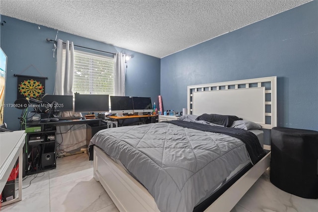 bedroom featuring a textured ceiling