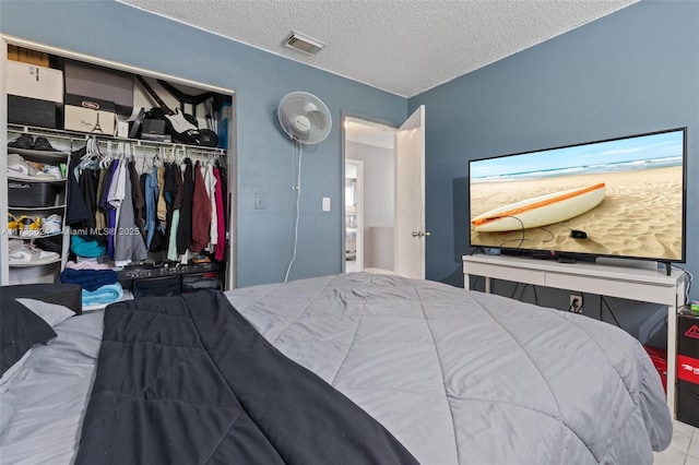 bedroom featuring a closet and a textured ceiling