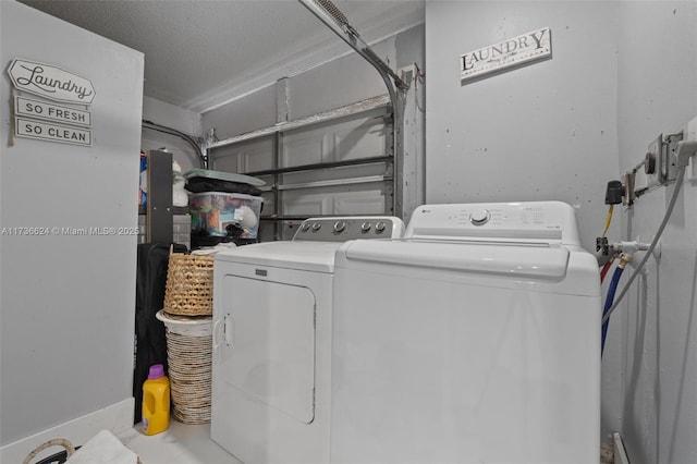 laundry room with washing machine and clothes dryer